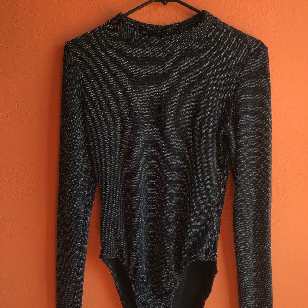 Awesome grey and black body suit.🔥